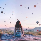 Experience the ultimate romance with a balloon ride for couples in Cappadocia, floating above stunning valleys at sunrise for an adventure