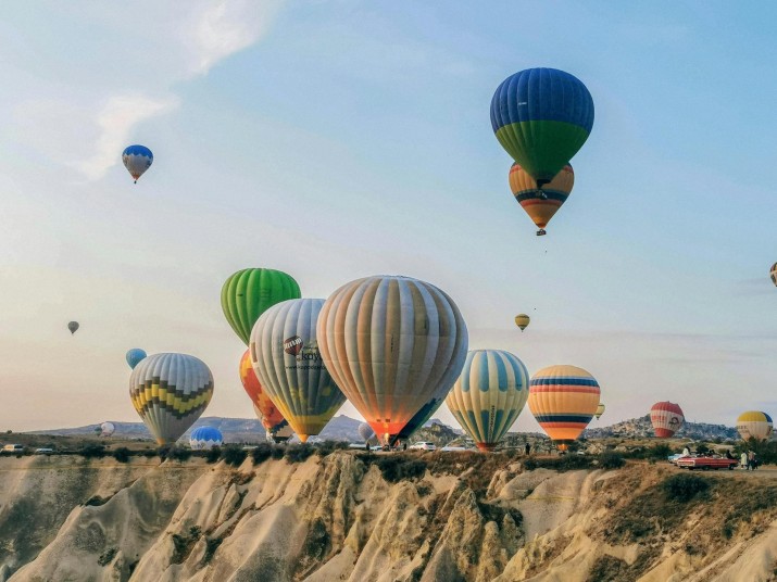 Experience the magic of Cappadocia with a balloon ride, offering stunning views of the landscape and unique rock formations at sunrise