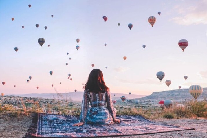 Experience the ultimate romance with a balloon ride for couples in Cappadocia, floating above stunning valleys at sunrise for an adventure