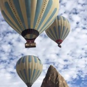 Book hot air balloon in Cappadocia for an unforgettable experience, soaring above fairy chimneys and valleys, enjoying breathtaking sunrise views